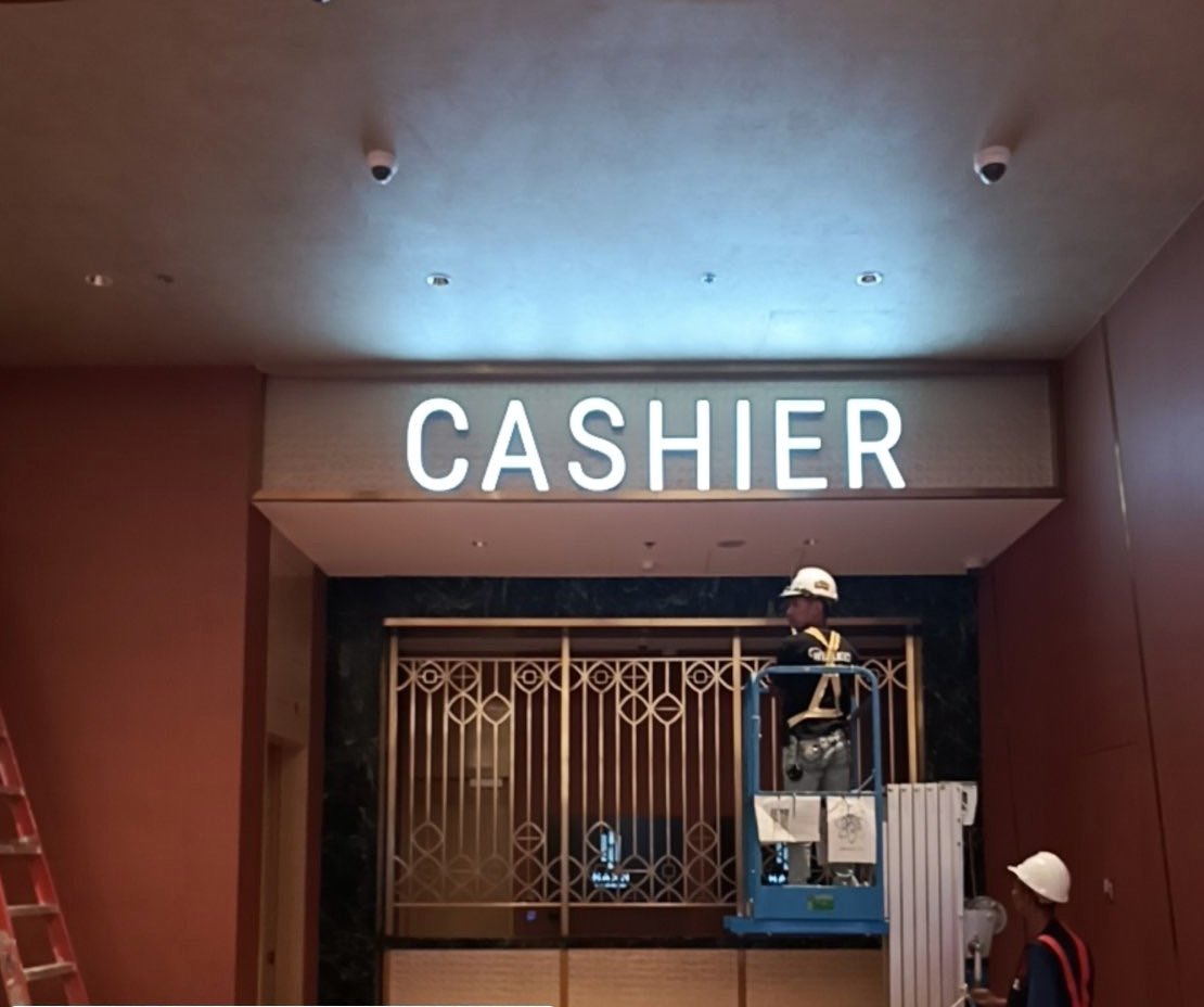 Cashier illuminated letters, installed and lit