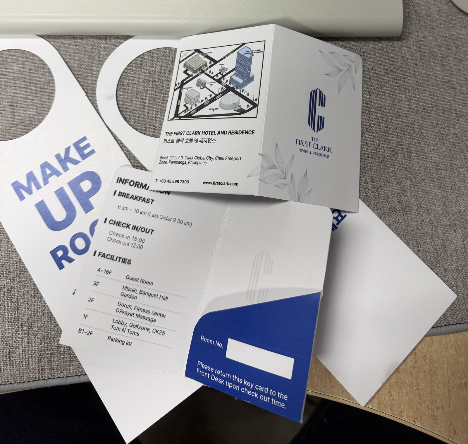 Make Up Room door hanger and hotel information folder