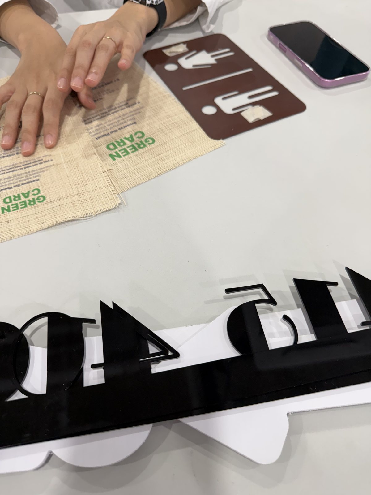 Cut-out numerals and arrows laid out before installation