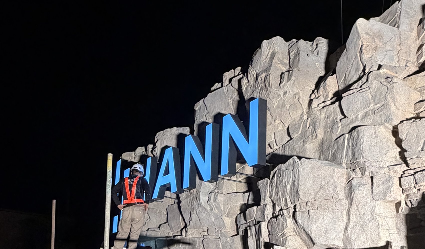 Wiltech crew installing illuminated letters at night