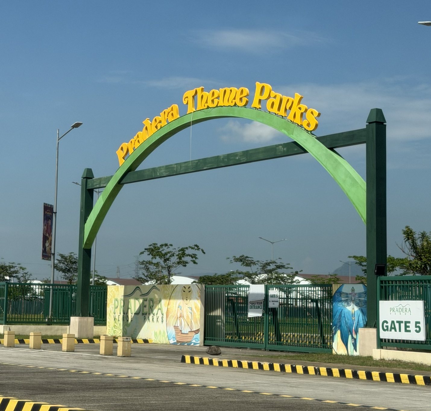 Pradera Theme Parks entrance arch with dimensional yellow lettering over Gate 5
