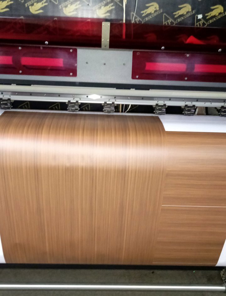 Timber-grain face coming off the large-format printer